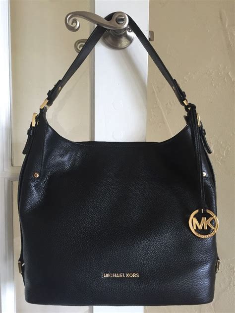 michael kors black purse vintage gold hardware|vintage Michael Kors handbags 1981.